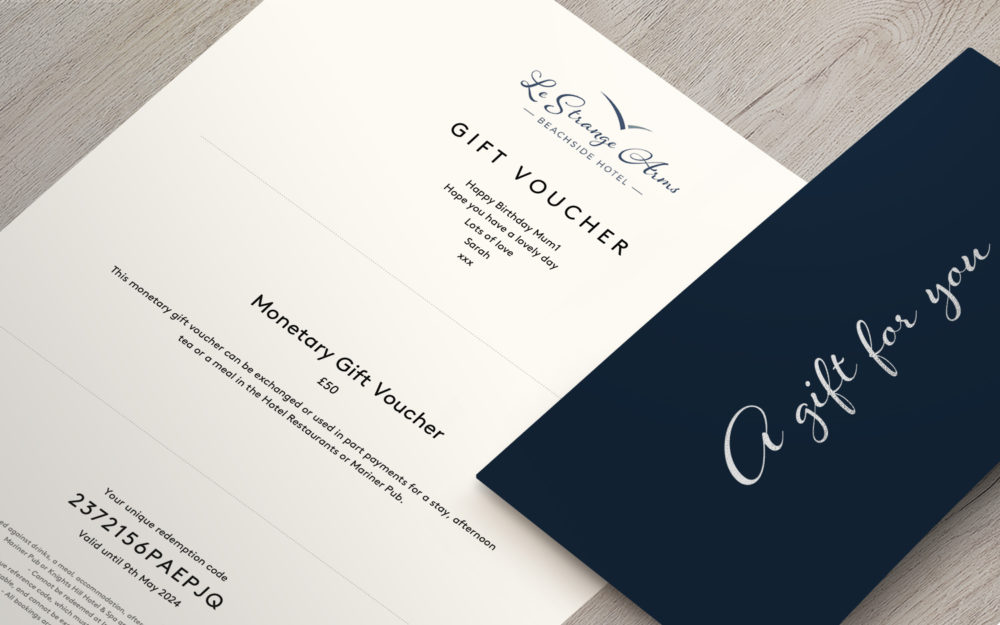 Image of a gift voucher for Le Strange Arms Hotel and Spa. The voucher is a monetary voucher worth £50 and can be used for a stay, afternoon tea, or a meal in the hotel Le Strange Amrs Beachside Hotel. The voucher also has a validity date.